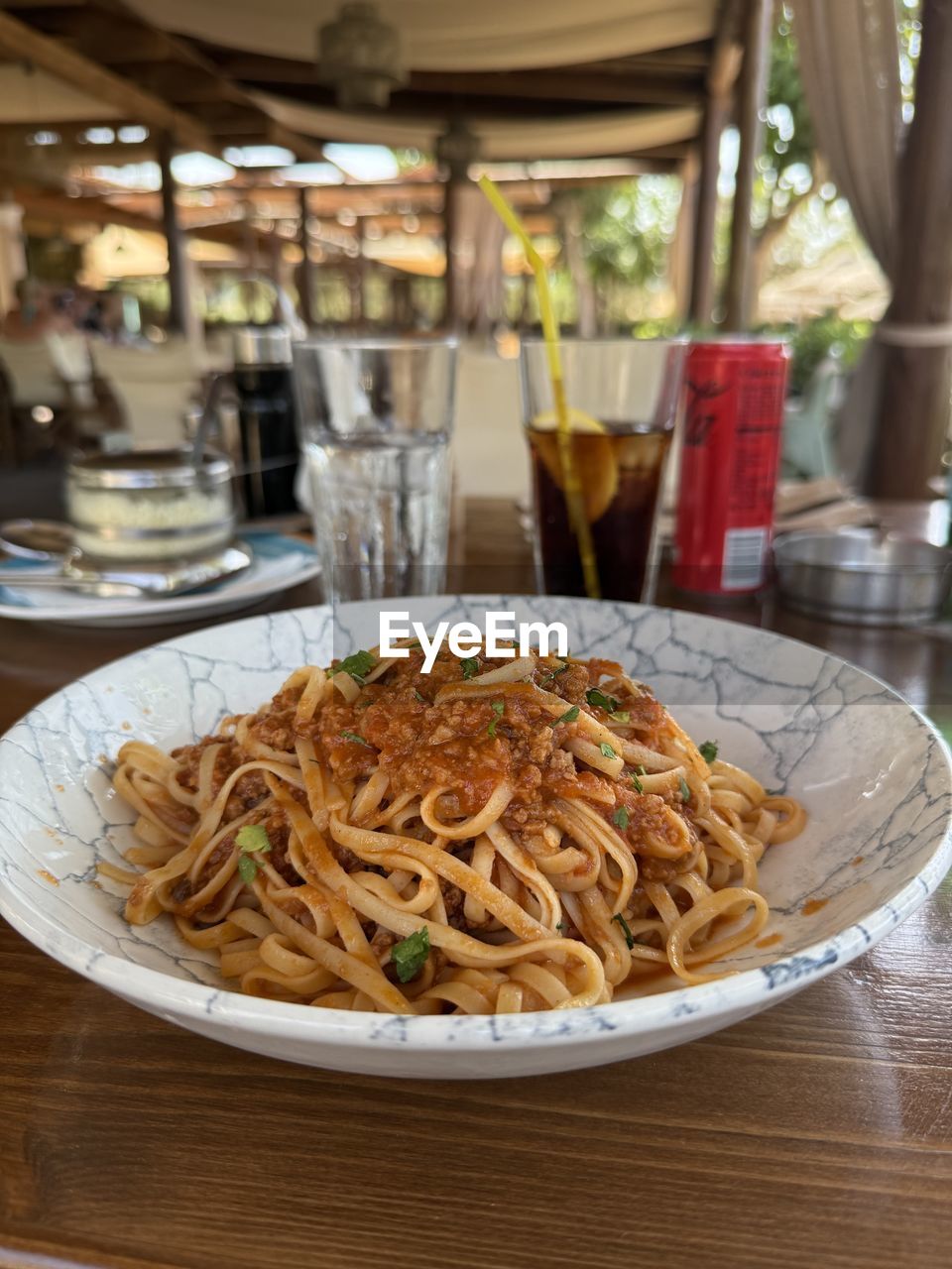food and drink, food, pasta, italian food, freshness, meal, indoors, dish, business, no people, healthy eating, wellbeing, spaghetti, restaurant, cuisine, table, wood, still life, close-up, focus on foreground
