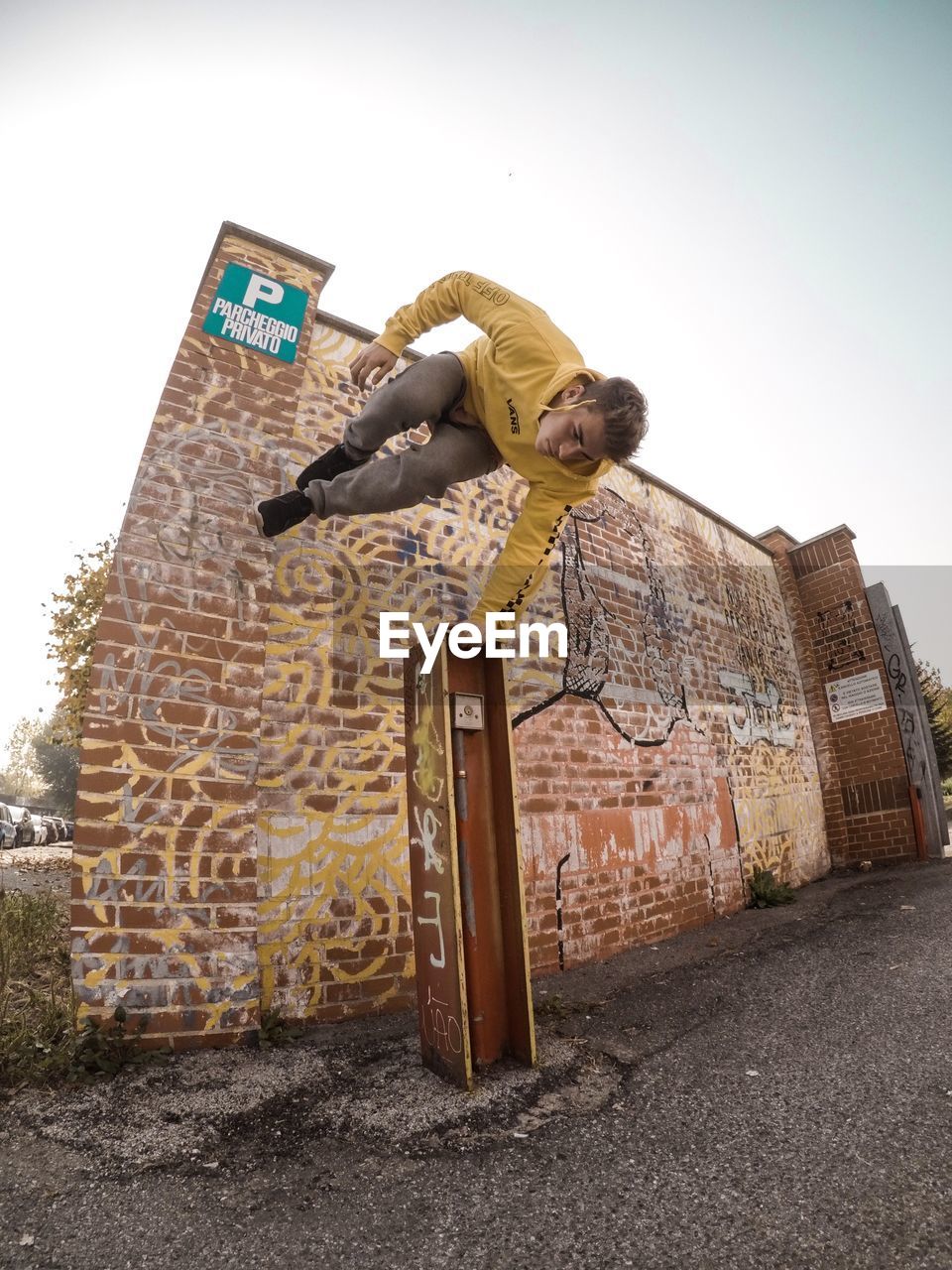 MAN STANDING ON WALL