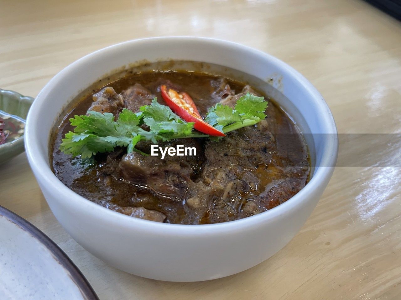 food and drink, food, dish, healthy eating, bowl, meat, wellbeing, asian food, soup, table, vegetable, freshness, cuisine, no people, indoors, meal, produce, high angle view, stew, red meat, beef, spice, close-up