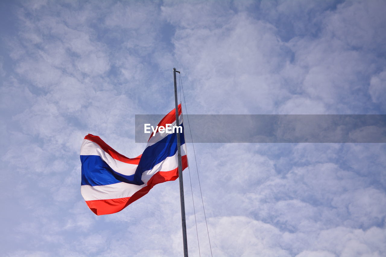 Low angle view of flag against sky