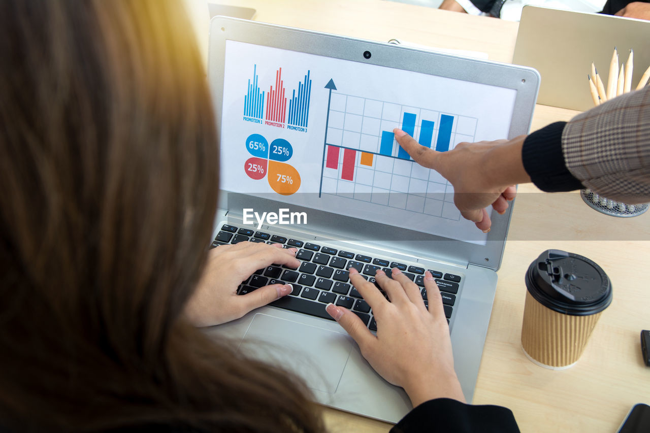 business, technology, computer, communication, adult, finance, business finance and industry, working, wireless technology, learning, women, table, occupation, graph, office, corporate business, professional occupation, businesswoman, diagram, indoors, finance and economy, using computer, desk, planning, computer equipment, internet, furniture, computer network, businessman, writing, trading, computer monitor, white-collar worker, young adult, new business, female, financial advisor, men, investment, meeting, person, chart, place of work, business strategy, document, cooperation, high angle view, hand, digital tablet, sitting, businesswear, business meeting