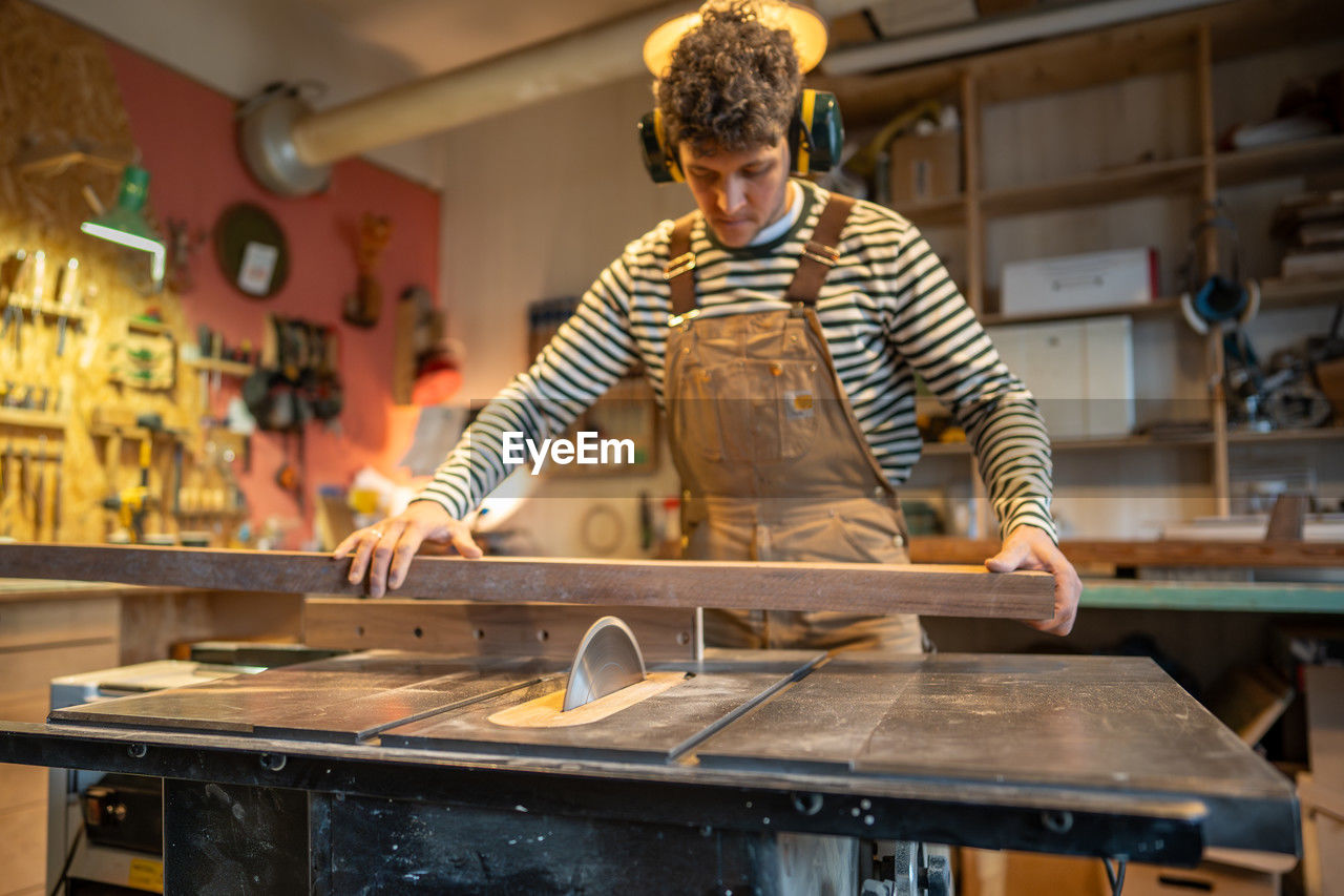 portrait of young man working at workshop