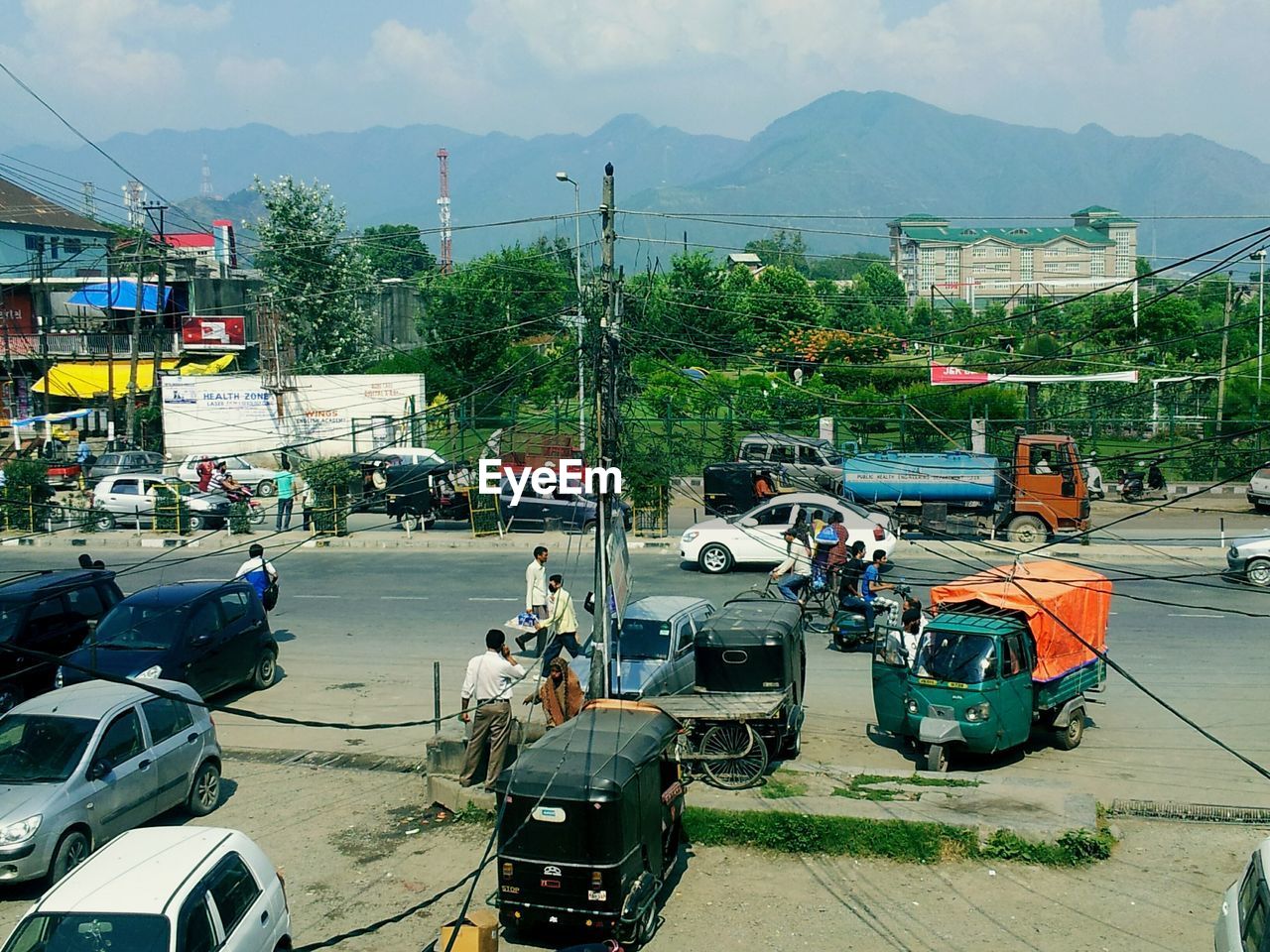 High angle view of people and vehicles on street