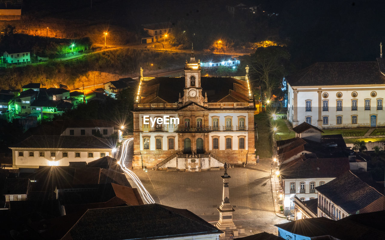 High angle view of illuminated street and buildings at night