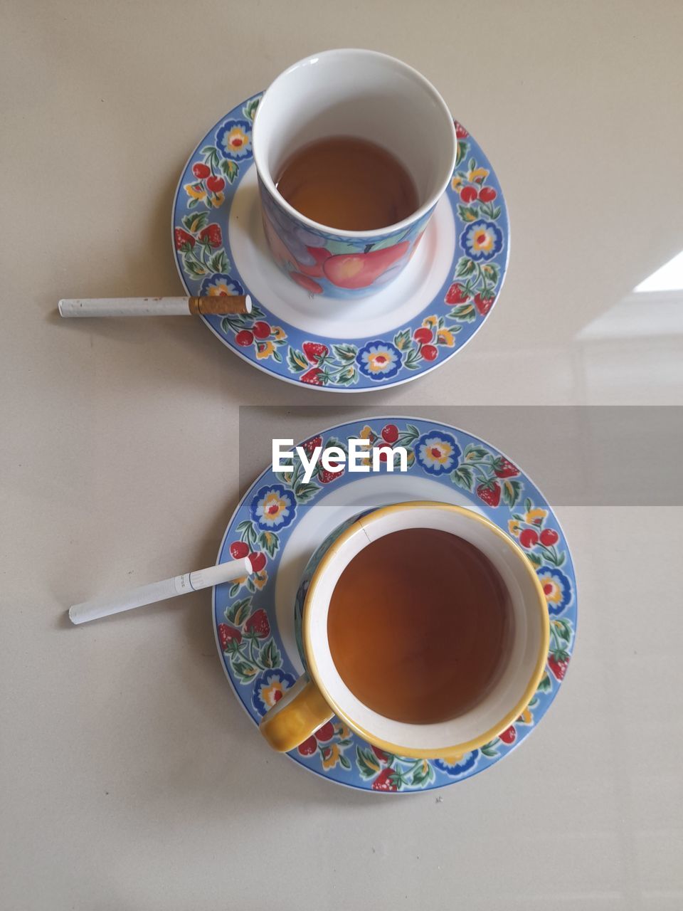 HIGH ANGLE VIEW OF COFFEE CUP AND TEA ON TABLE