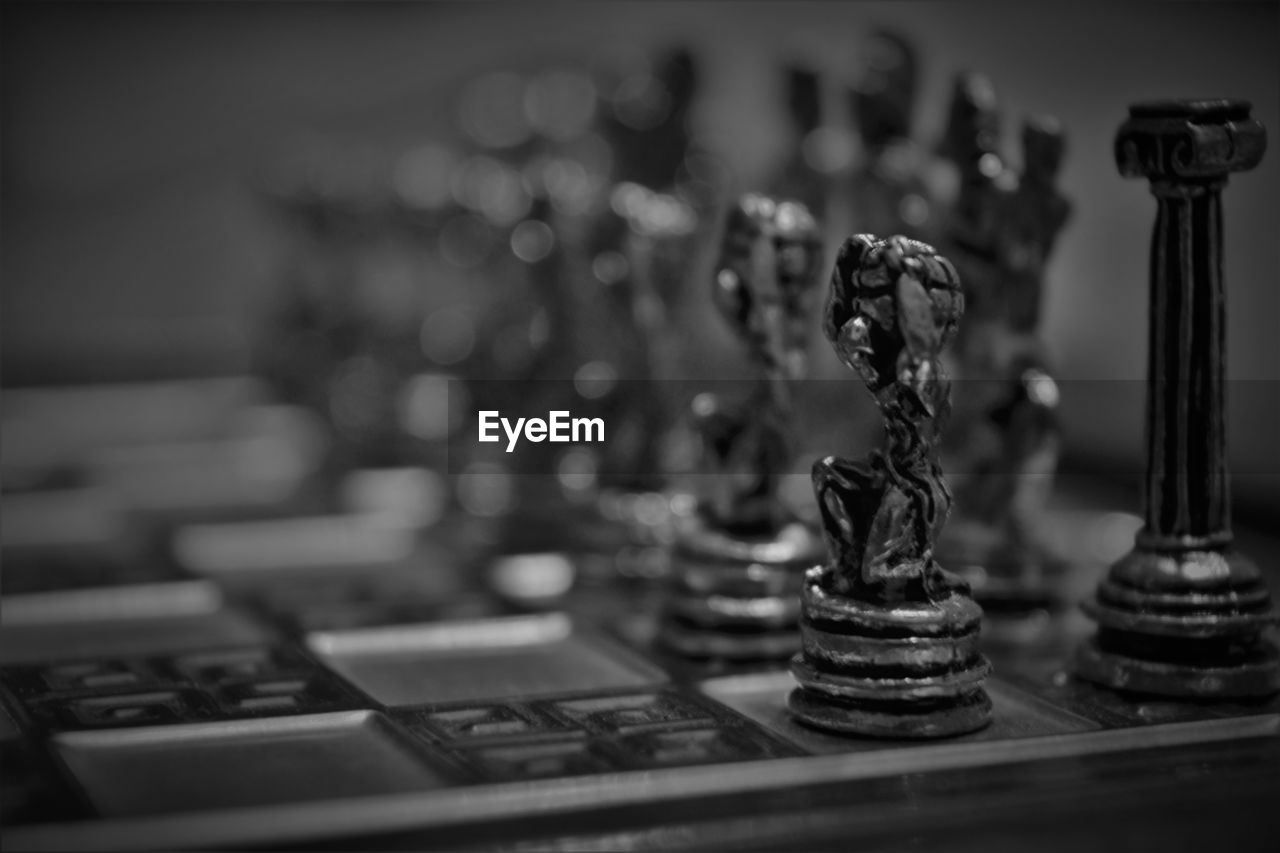 CLOSE-UP OF CHESS PIECES ON THE BOARD