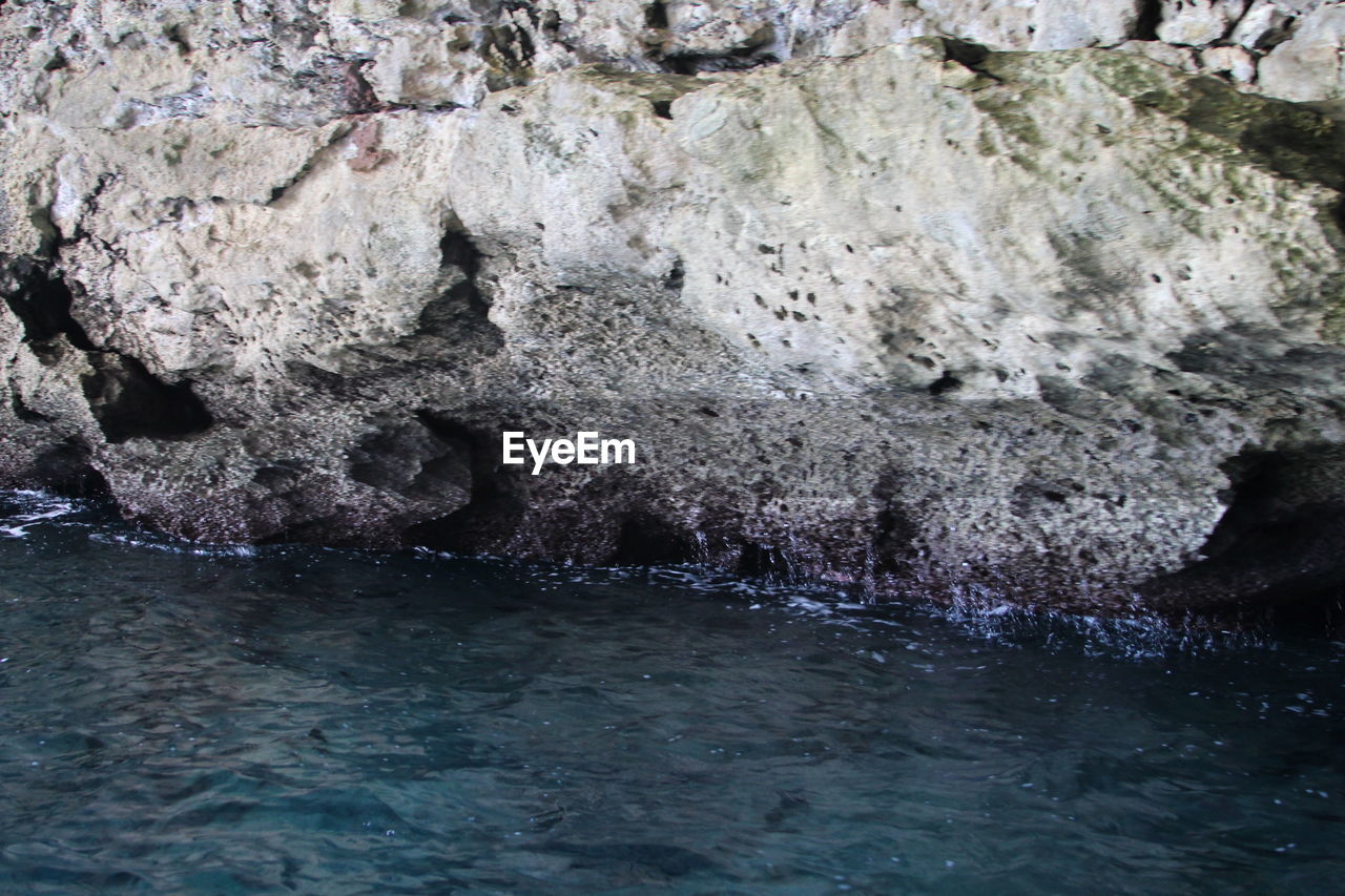 VIEW OF ROCKS IN WATER