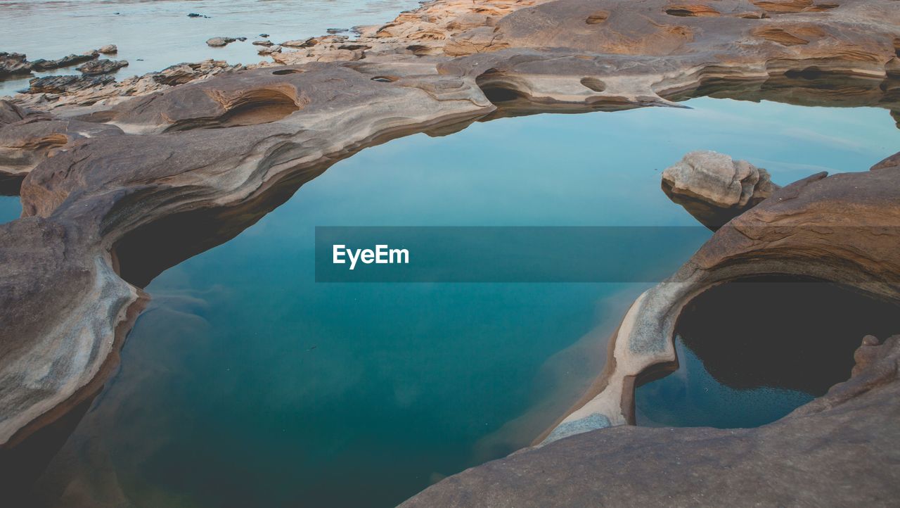 High angle view of tidal pool on rock formation