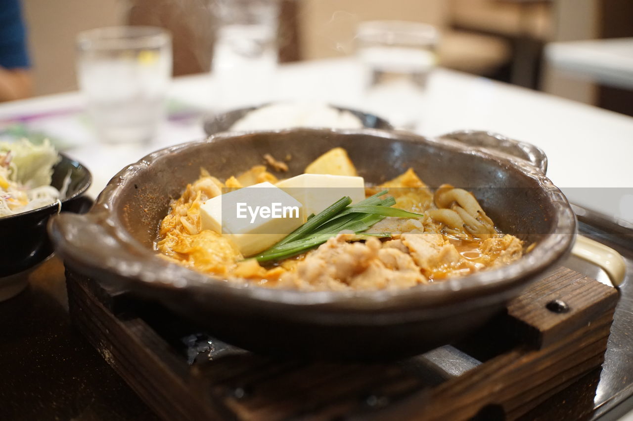 CLOSE-UP OF FOOD SERVED ON TABLE