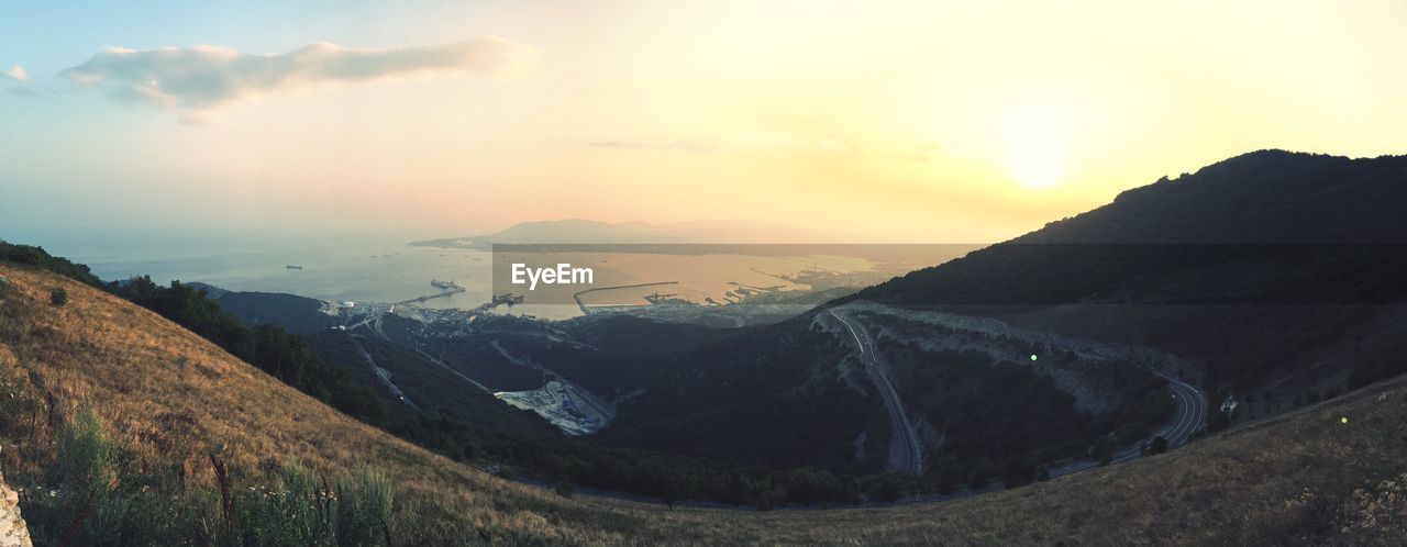 Scenic view of landscape against sky during sunset