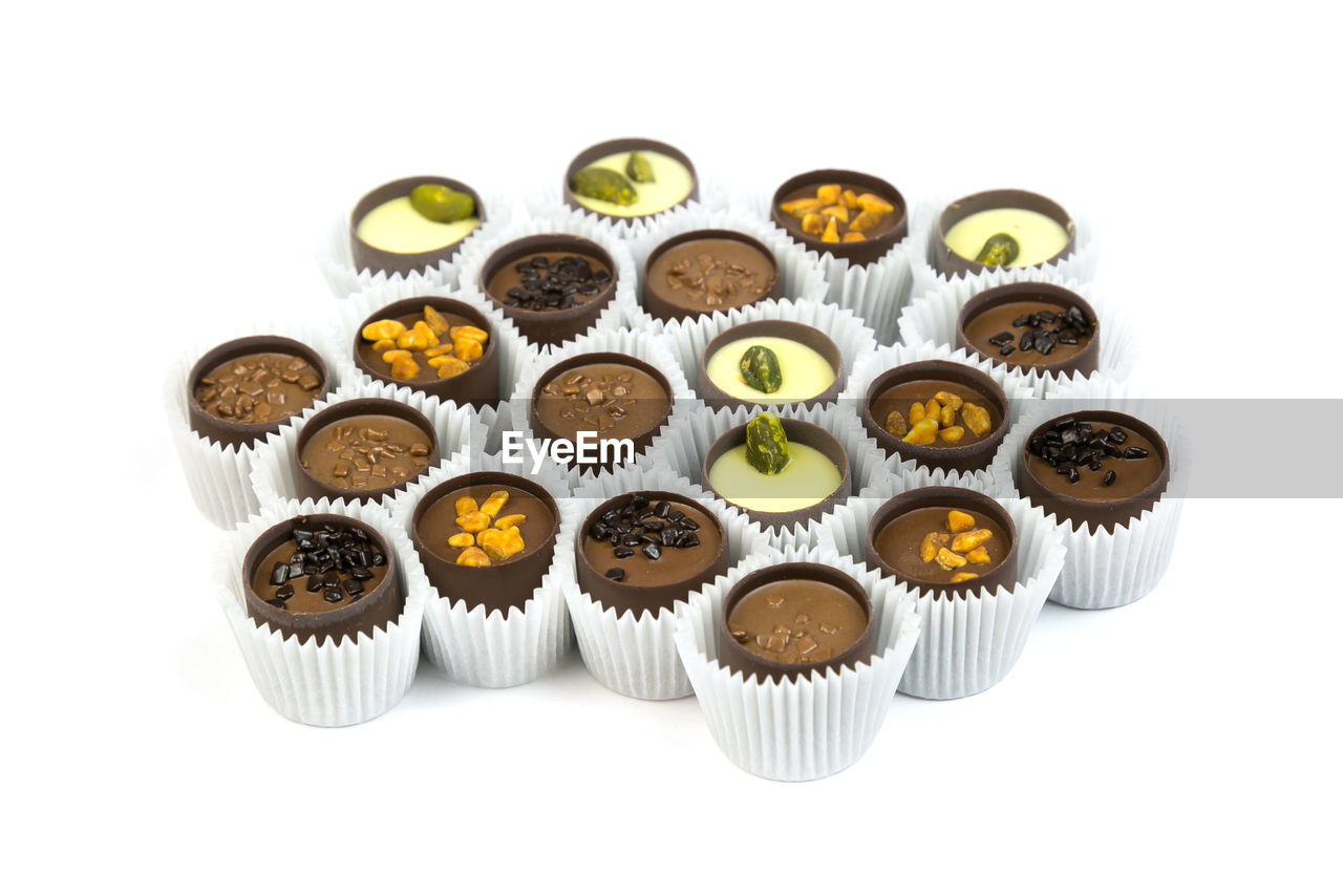 High angle view of cupcakes against white background