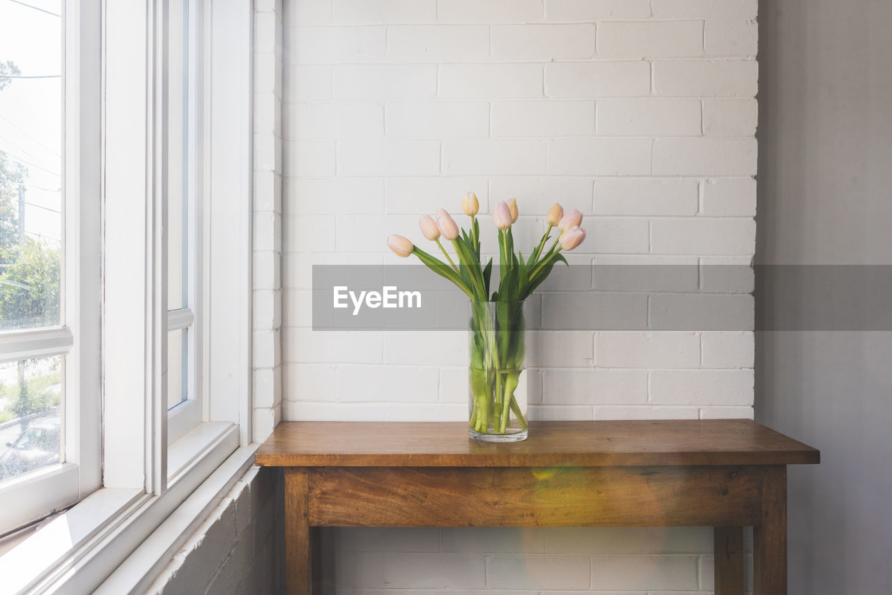 FLOWER VASE ON WINDOW AT HOME