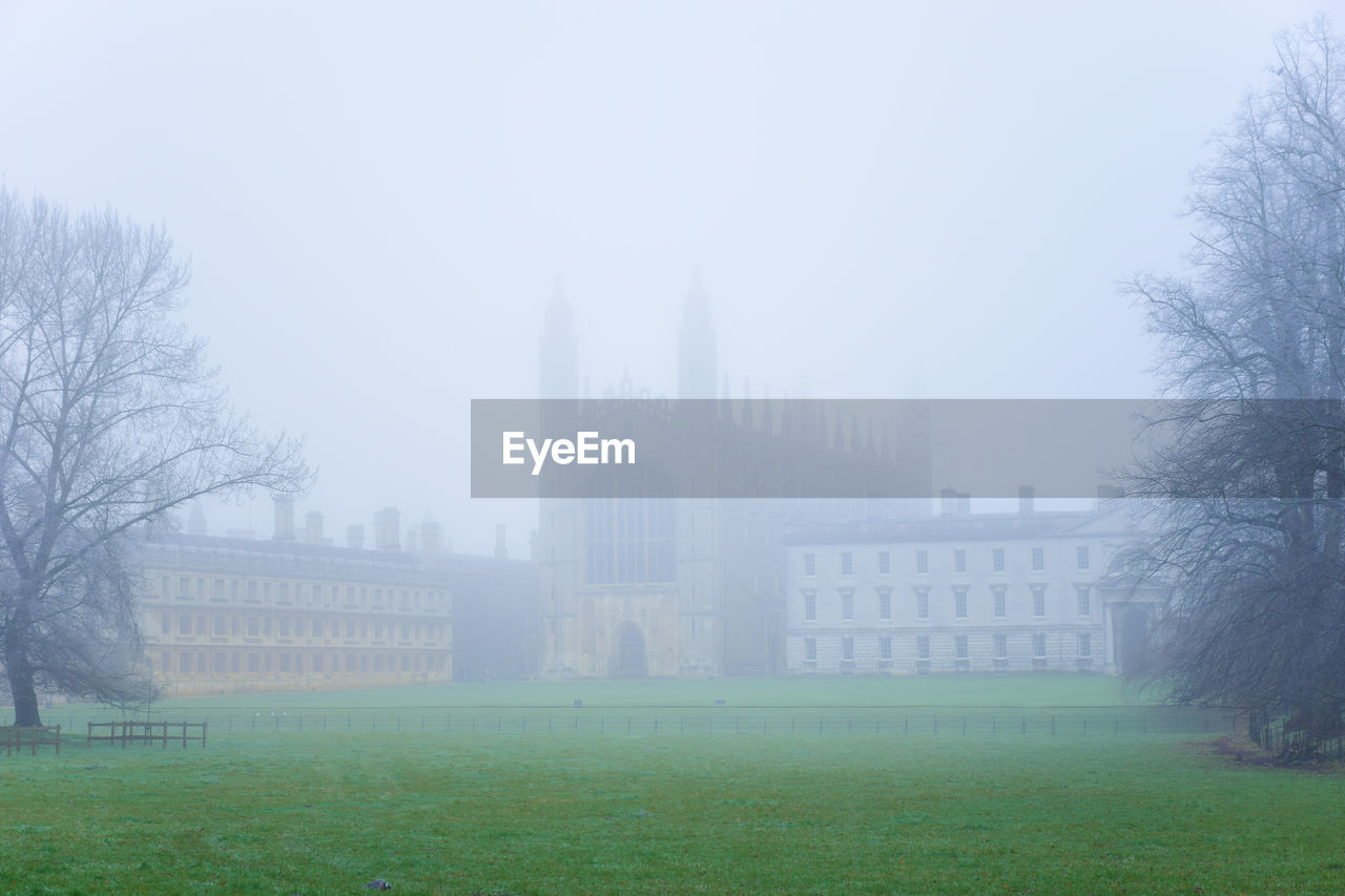Cambridge university against sky in city during foggy weather