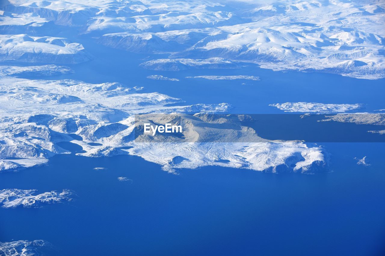 AERIAL VIEW OF SNOWCAPPED MOUNTAINS