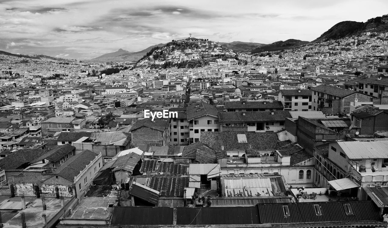 Cityscape with mountain range in background