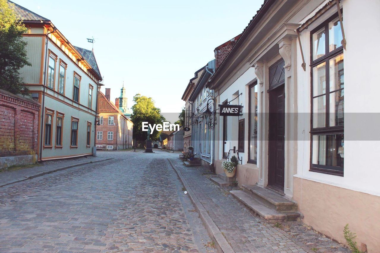 VIEW OF STREET AMIDST BUILDINGS