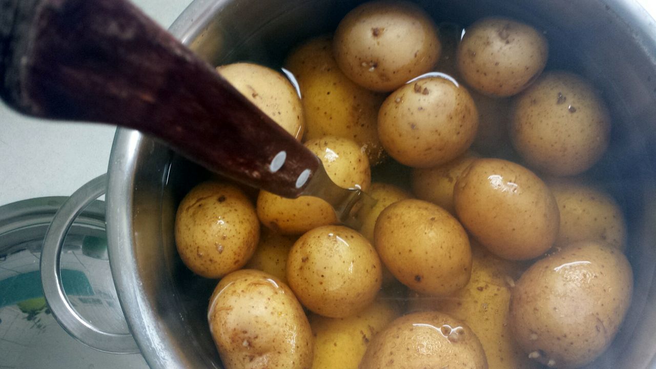 High angle view of boiled potatoes in container