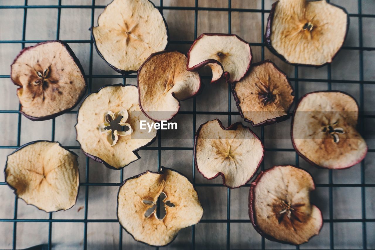 Directly above of slices of dried apples on tray