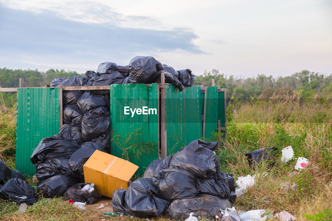 GARBAGE BIN IN FIELD