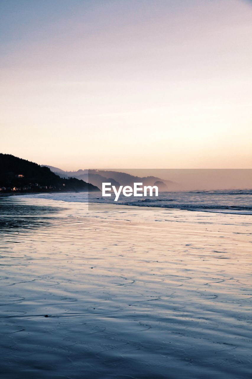 Scenic view of sea against sky during sunset