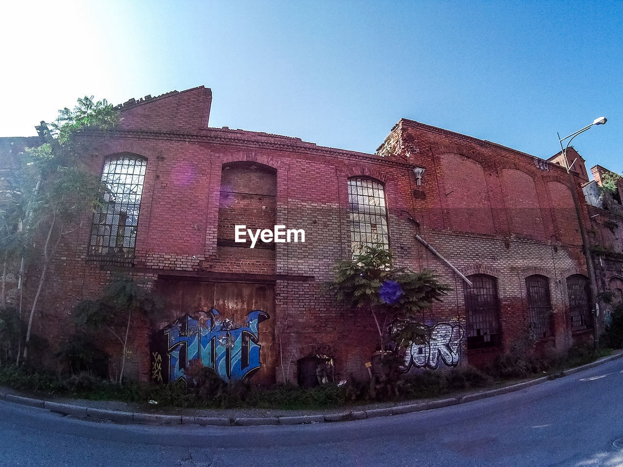 Low angle view of old weathered building against sky