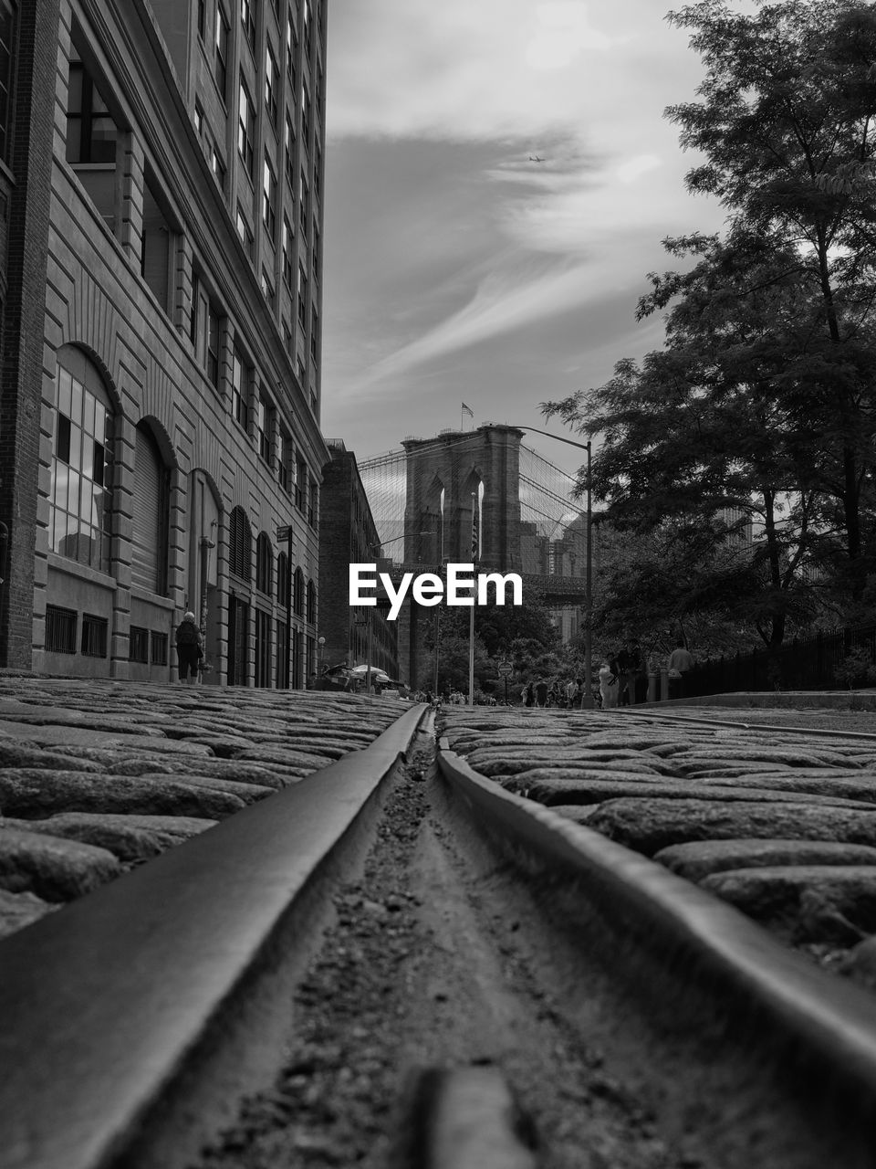 Railroad track against buildings in city