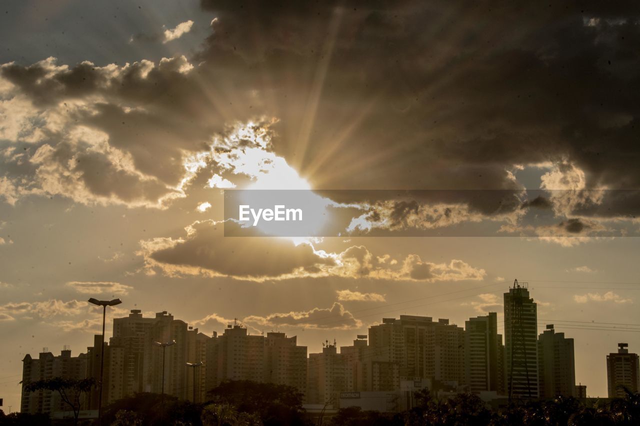 BUILDINGS AGAINST SKY AT SUNSET