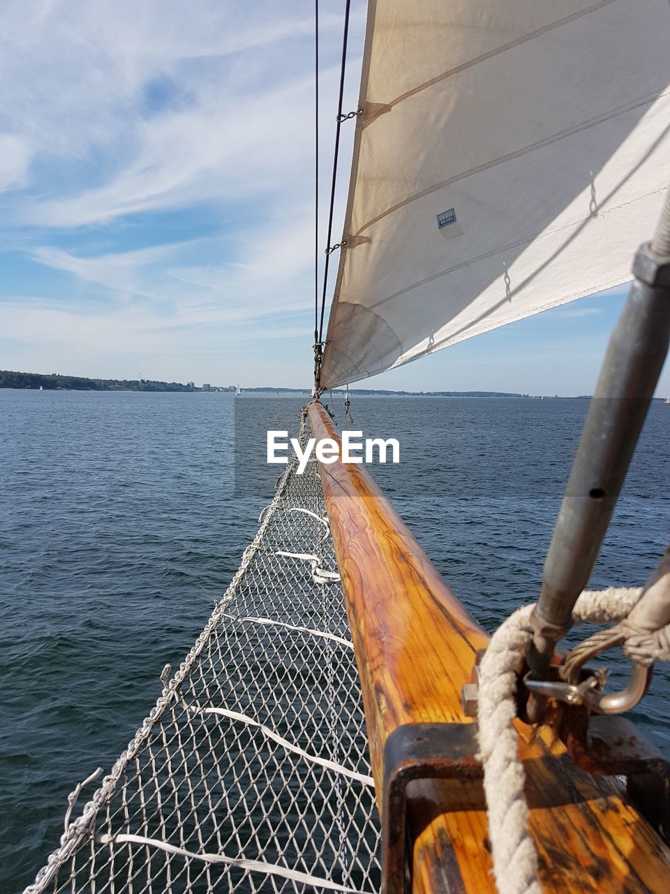 Cropped image of sailboat on sea against sky