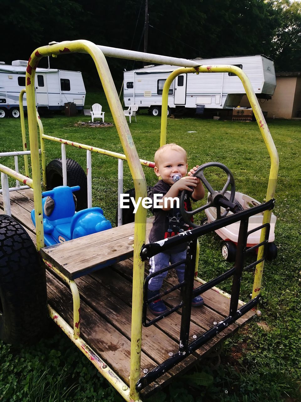 BOY PLAYING ON THE GROUND