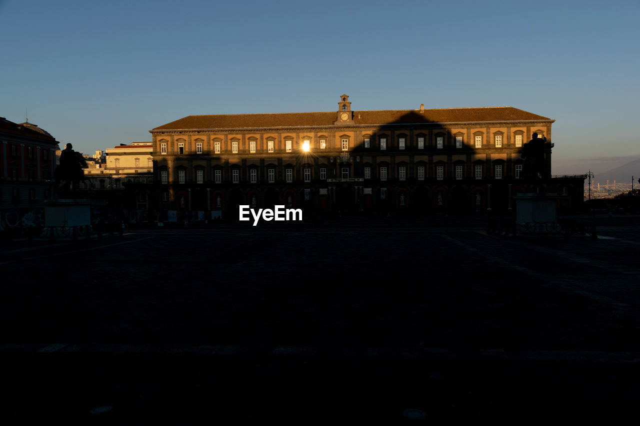 VIEW OF BUILDINGS IN CITY AGAINST CLEAR SKY