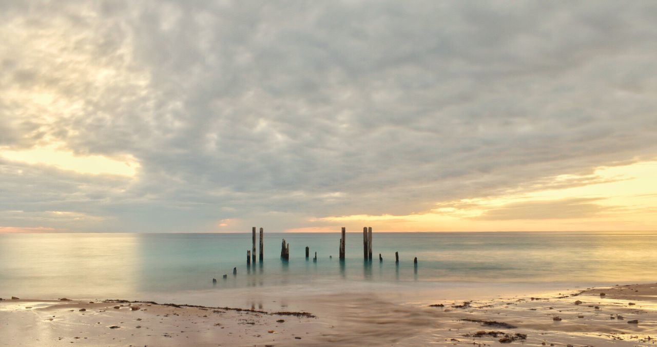 Scenic view of sea against sky at sunset