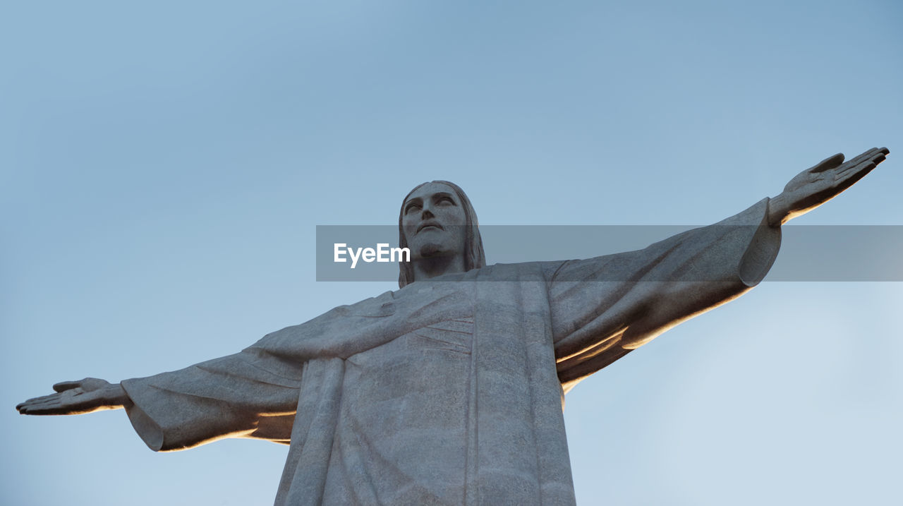 low angle view of woman standing against clear sky