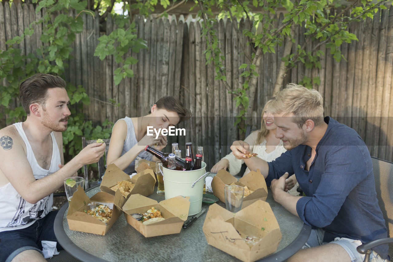 Friends eating at a party