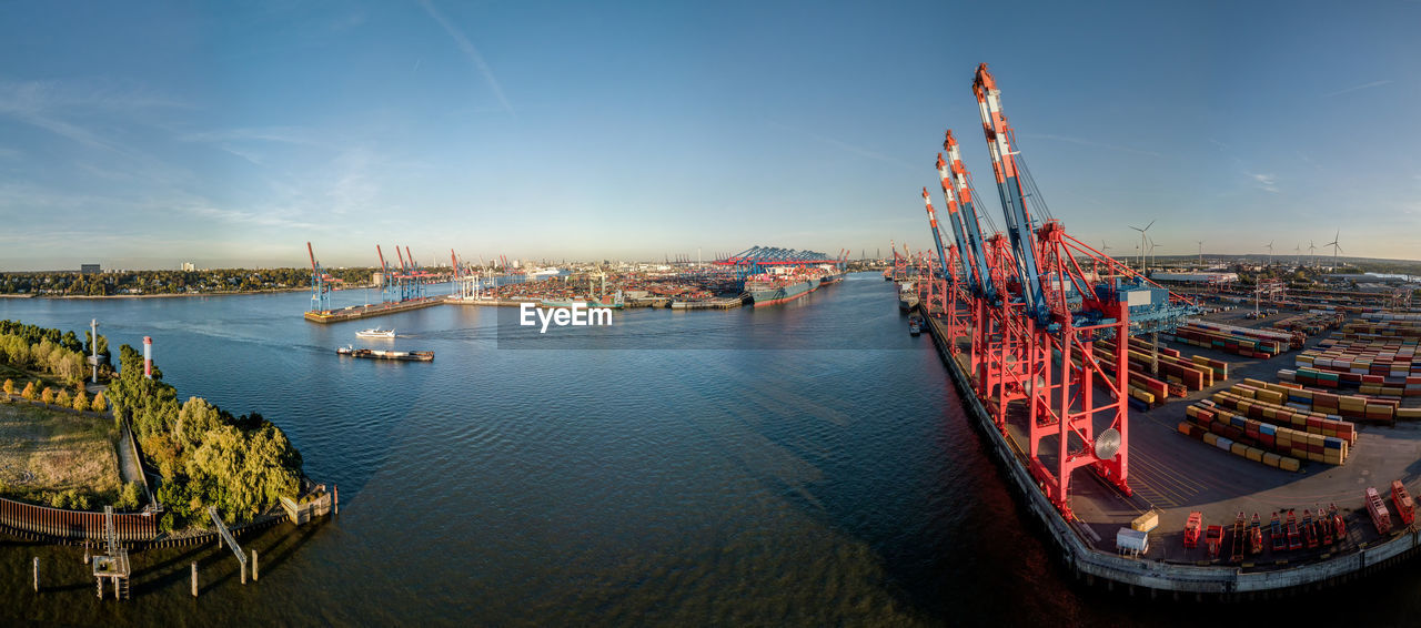 Large panorama of the port of hamburg at sunset