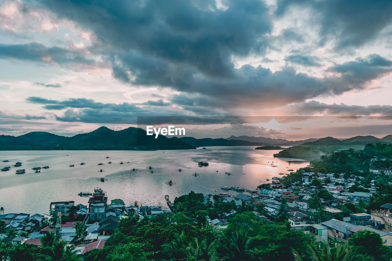 High angle view of sea and buildings against sky