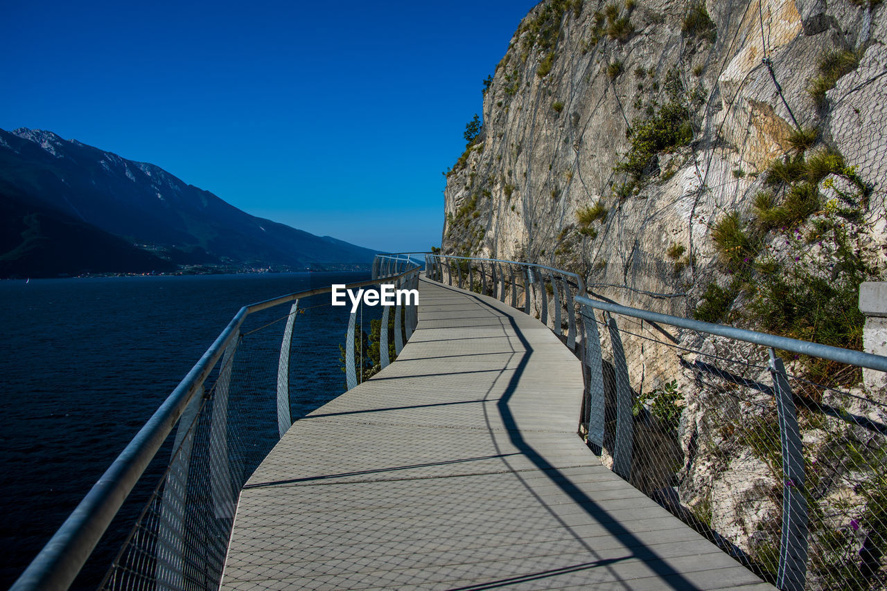 Suspended walkway on lake garda at limone sul garda, brescia italy