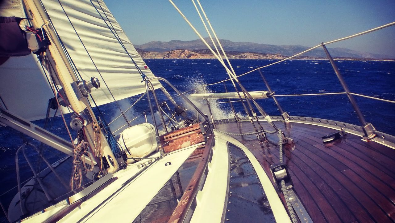 Close-up of a cropped boat in blue sea