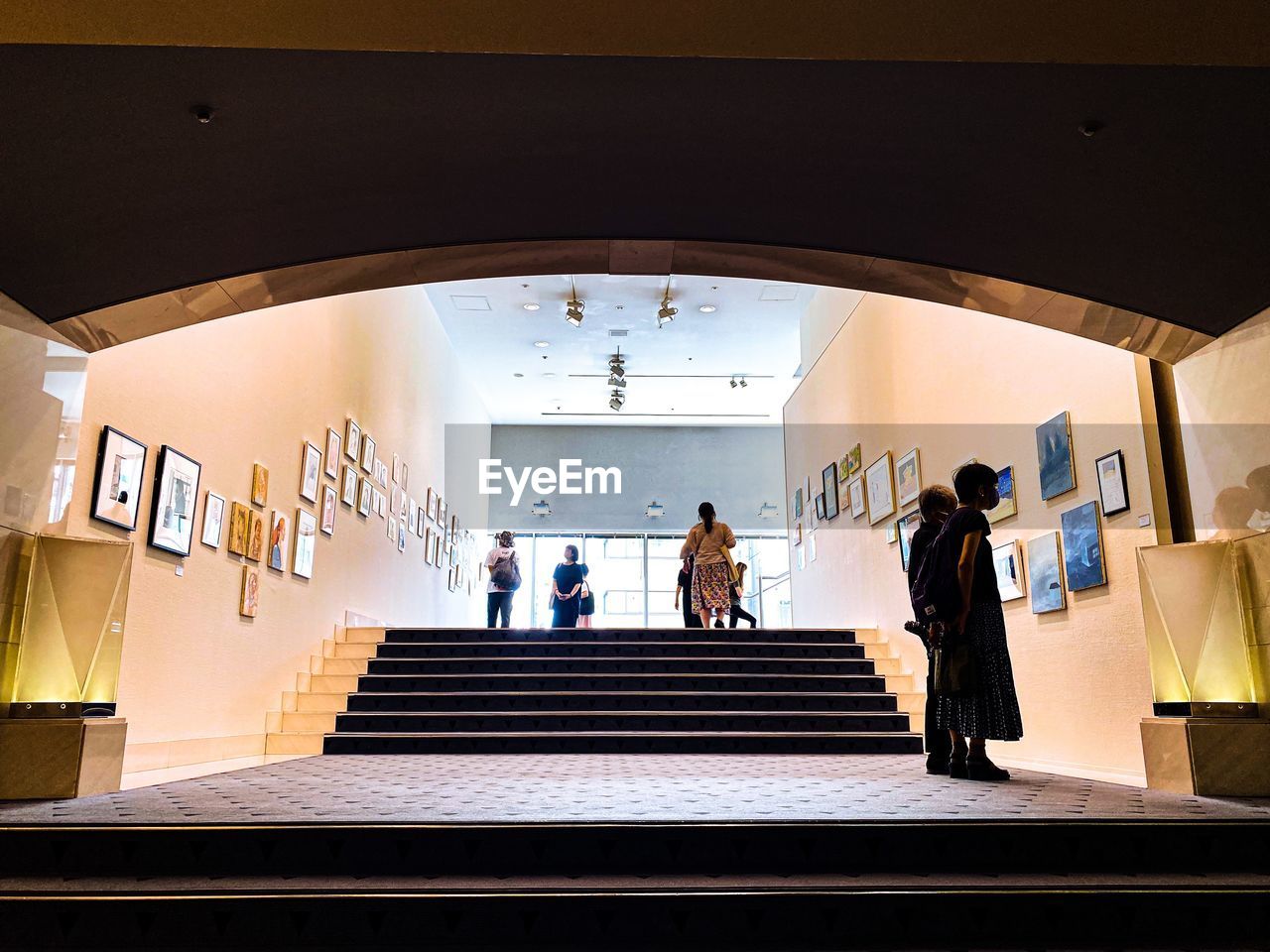 PEOPLE WALKING IN STAIRCASE