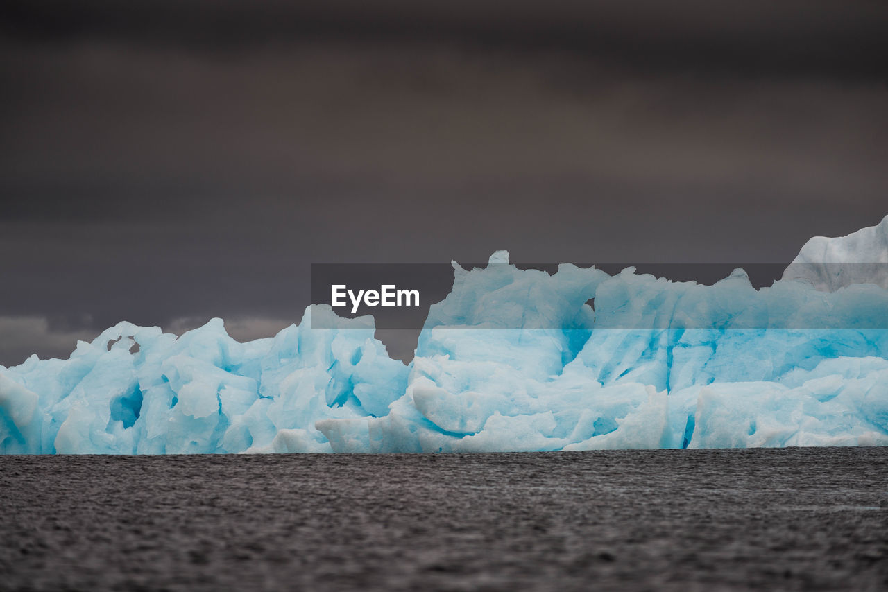 Scenic view of glacier against sky