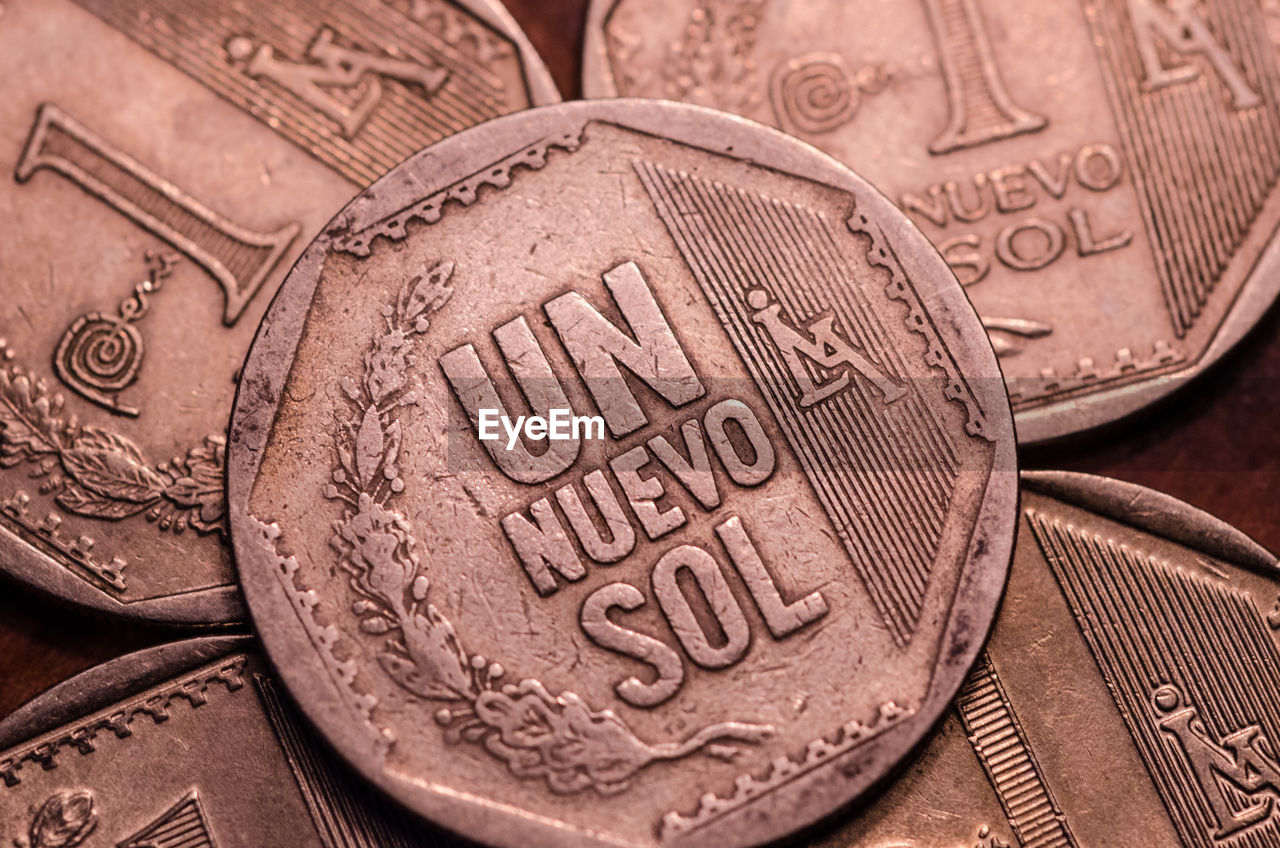 Close-up of old coins on table