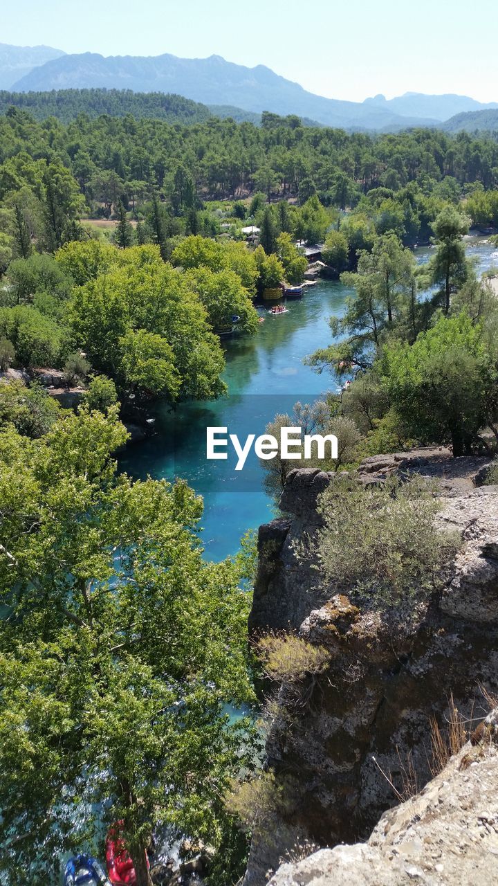 SCENIC VIEW OF LAKE AGAINST TREES