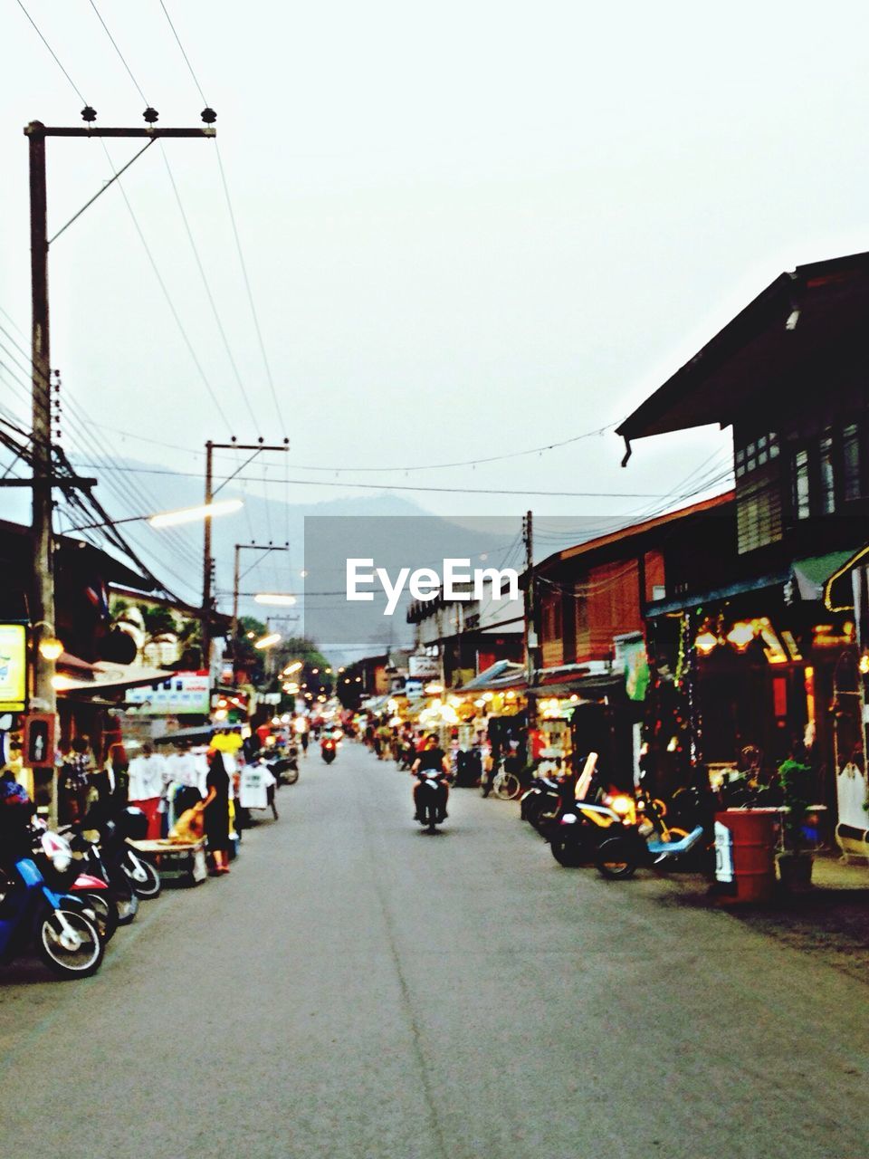 View of market in city at dusk