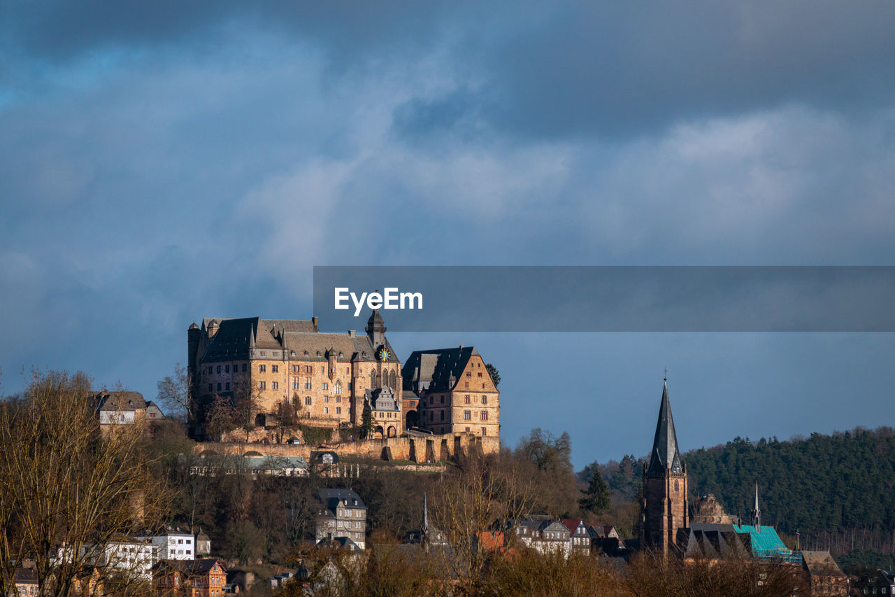 architecture, built structure, sky, building exterior, building, history, cloud, the past, nature, tree, travel destinations, plant, castle, cityscape, travel, place of worship, city, no people, evening, old, house, medieval, religion, tower, outdoors, tourism, landscape, residential district, land, château