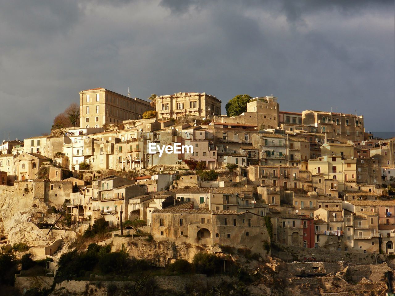 Houses in city against sky