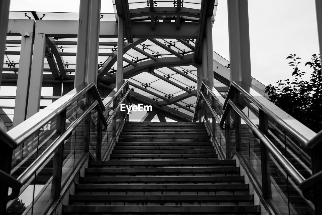 LOW ANGLE VIEW OF STAIRCASE AGAINST BUILDING AGAINST SKY