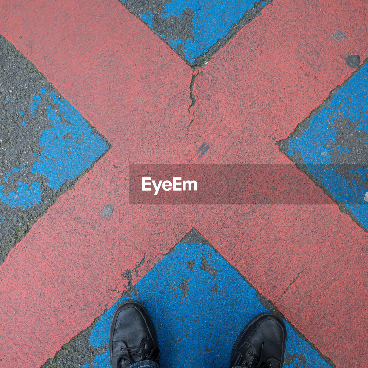 Close-up of cropped shoes