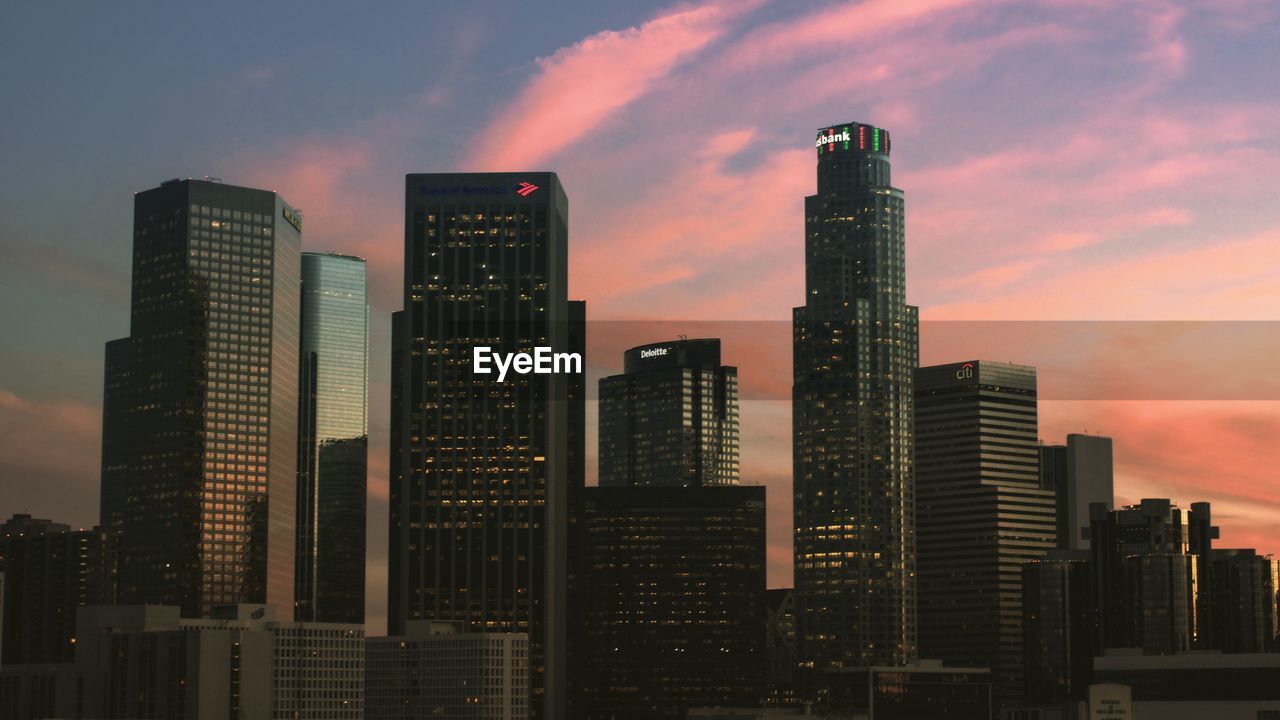 city, architecture, building exterior, skyscraper, office building exterior, built structure, landscape, sky, building, urban skyline, skyline, cityscape, metropolitan area, sunset, residential district, downtown district, cloud, nature, metropolis, travel destinations, urban area, downtown, dusk, city life, office, horizon, no people, business, tower block, evening, travel, outdoors, dramatic sky, illuminated, business finance and industry, tower, night, development