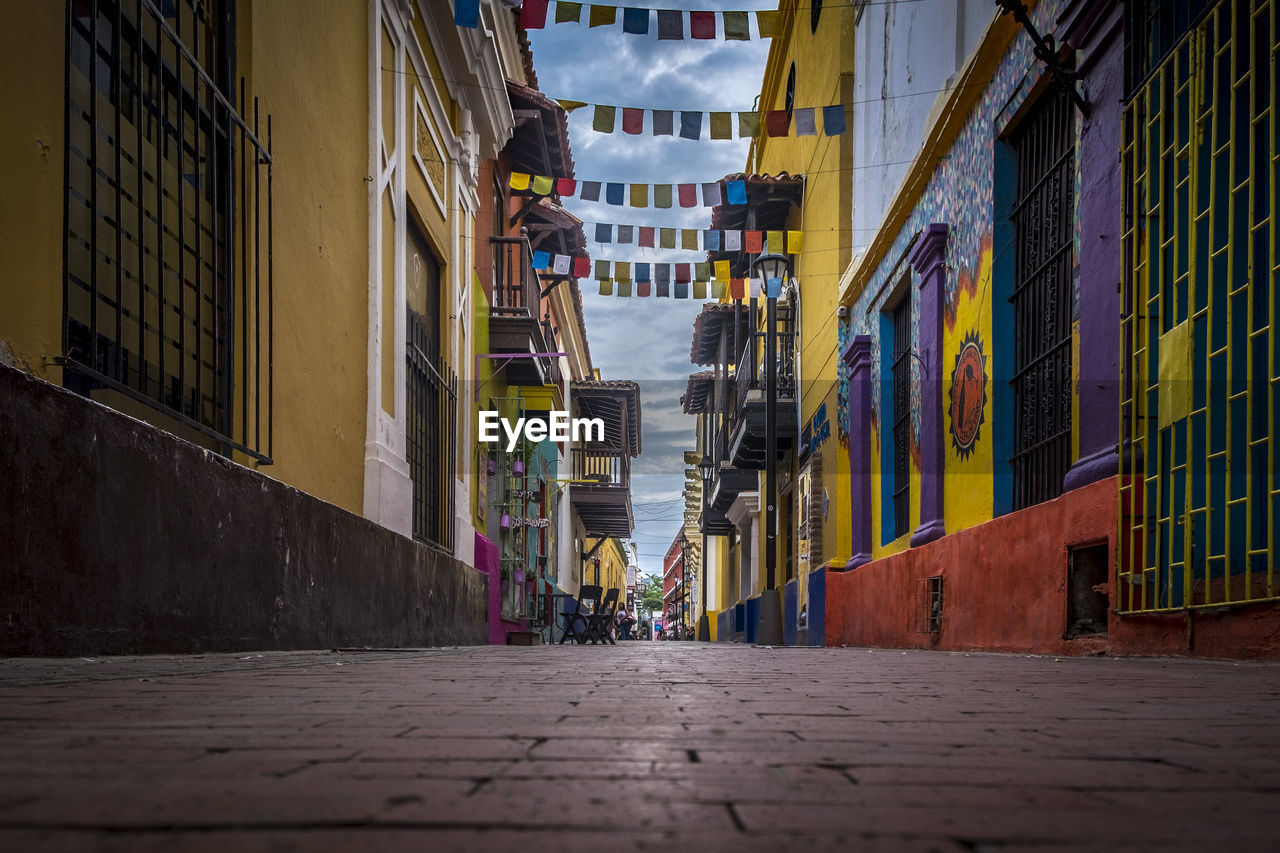 MAN WALKING IN ALLEY