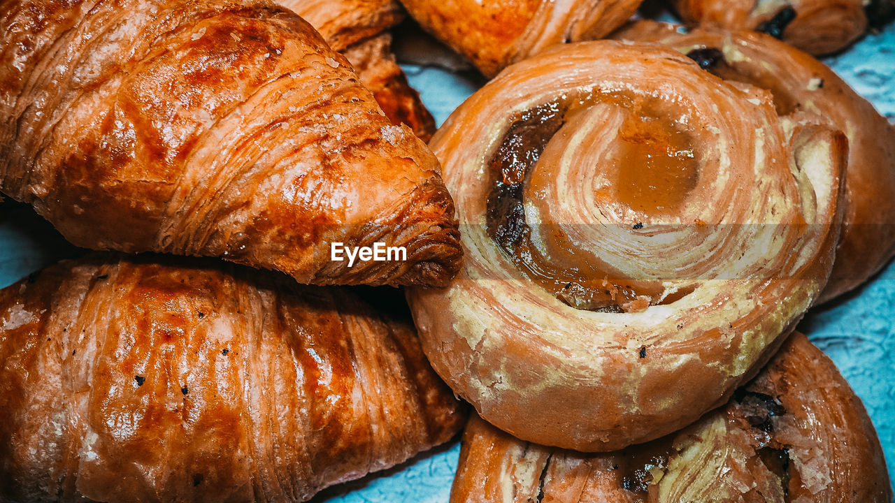 Classic french butter croissant and raisin swirl, pain aux raisins from france. 