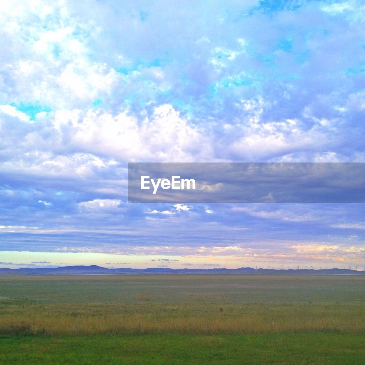 SCENIC VIEW OF LANDSCAPE AGAINST CLOUDY SKY